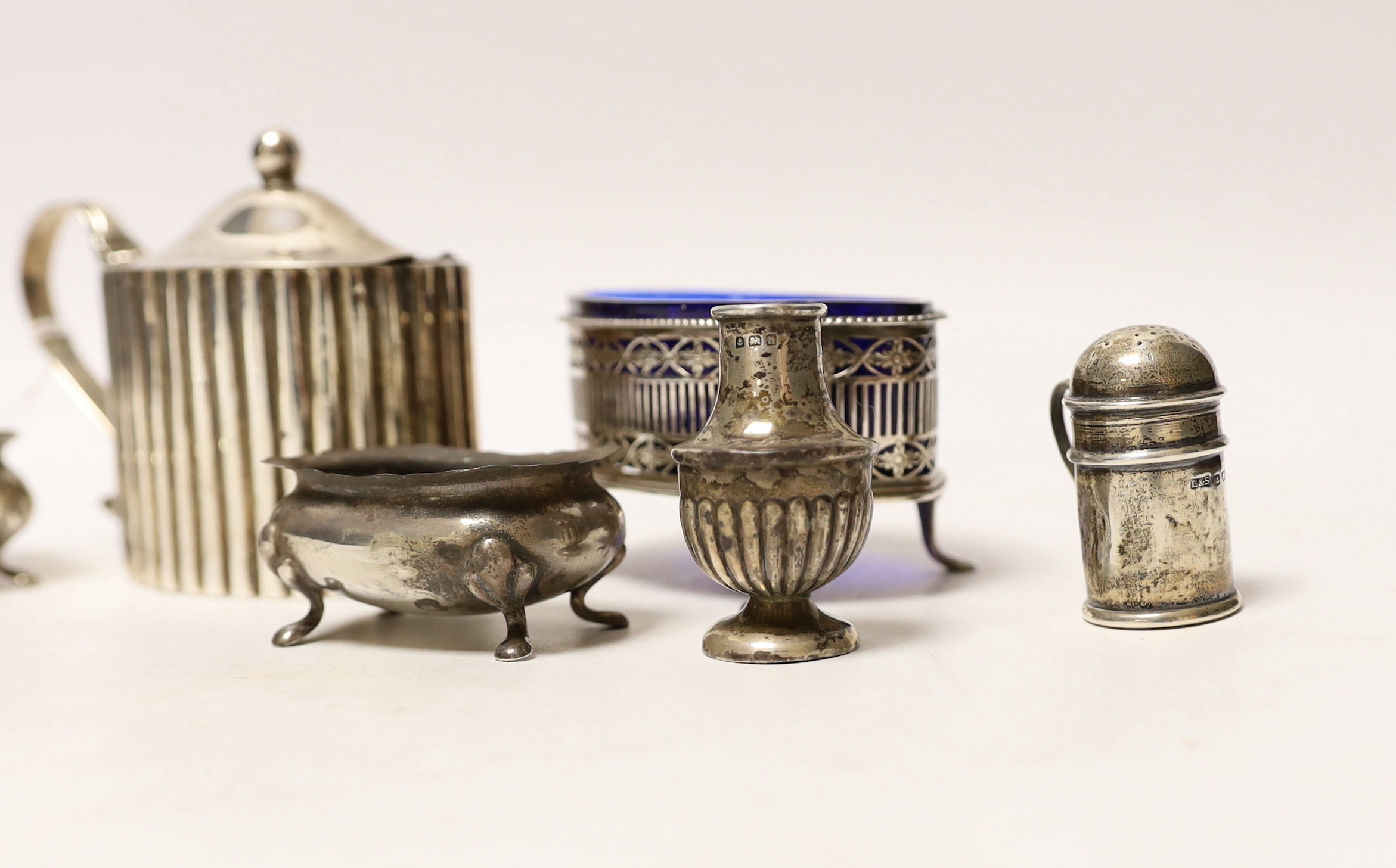 A George III silver mustard, by Peter & Jonathan Bateman, London, 1790 and six other minor silver condiments.